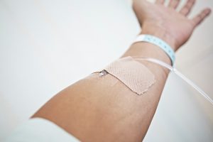 having an intravenous drip in hospital